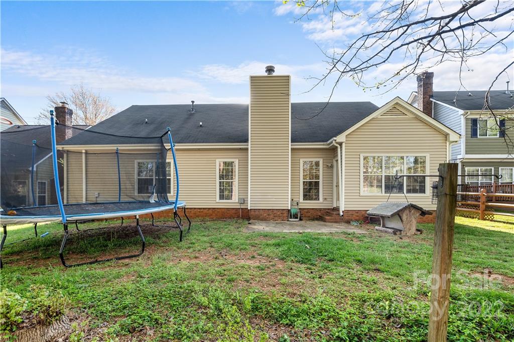 7001 Reedy Creek Road Charlotte, NC 28215 - Photo 22 of 24 a view of a house with a yard and sitting area