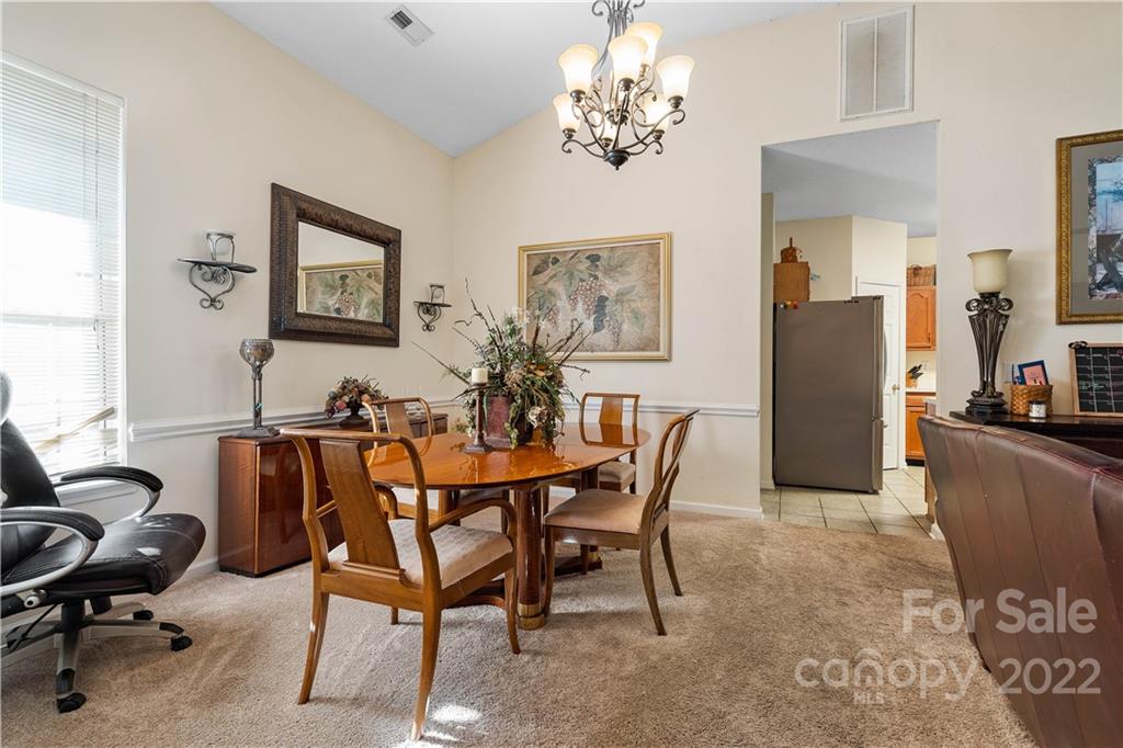 7001 Reedy Creek Road Charlotte, NC 28215 - Photo 4 of 24 a view of a dining room with furniture