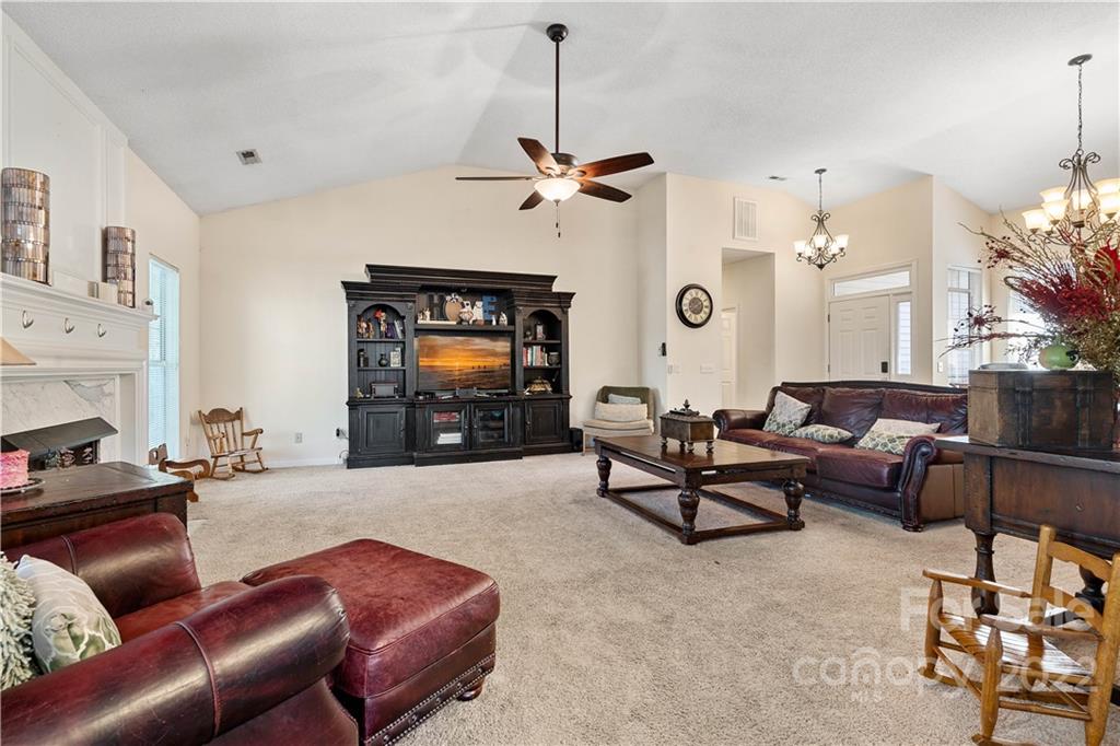 7001 Reedy Creek Road Charlotte, NC 28215 - Photo 7 of 24 a living room with furniture and a flat screen tv
