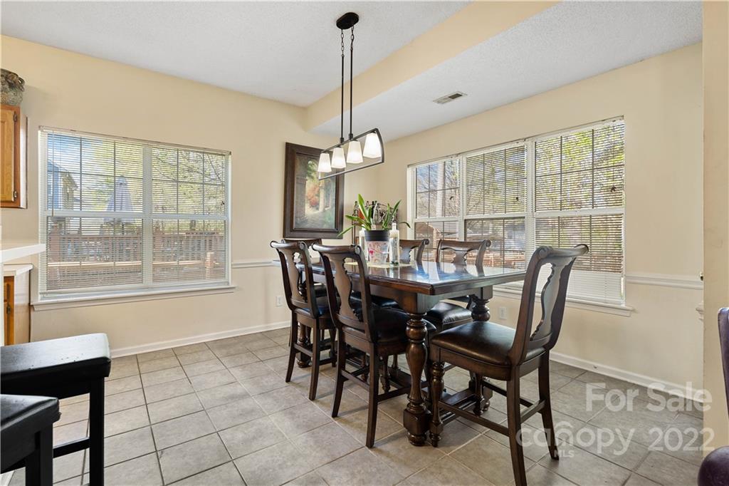 7001 Reedy Creek Road Charlotte, NC 28215 - Photo 8 of 24 a view of a dining room with furniture window and outside view