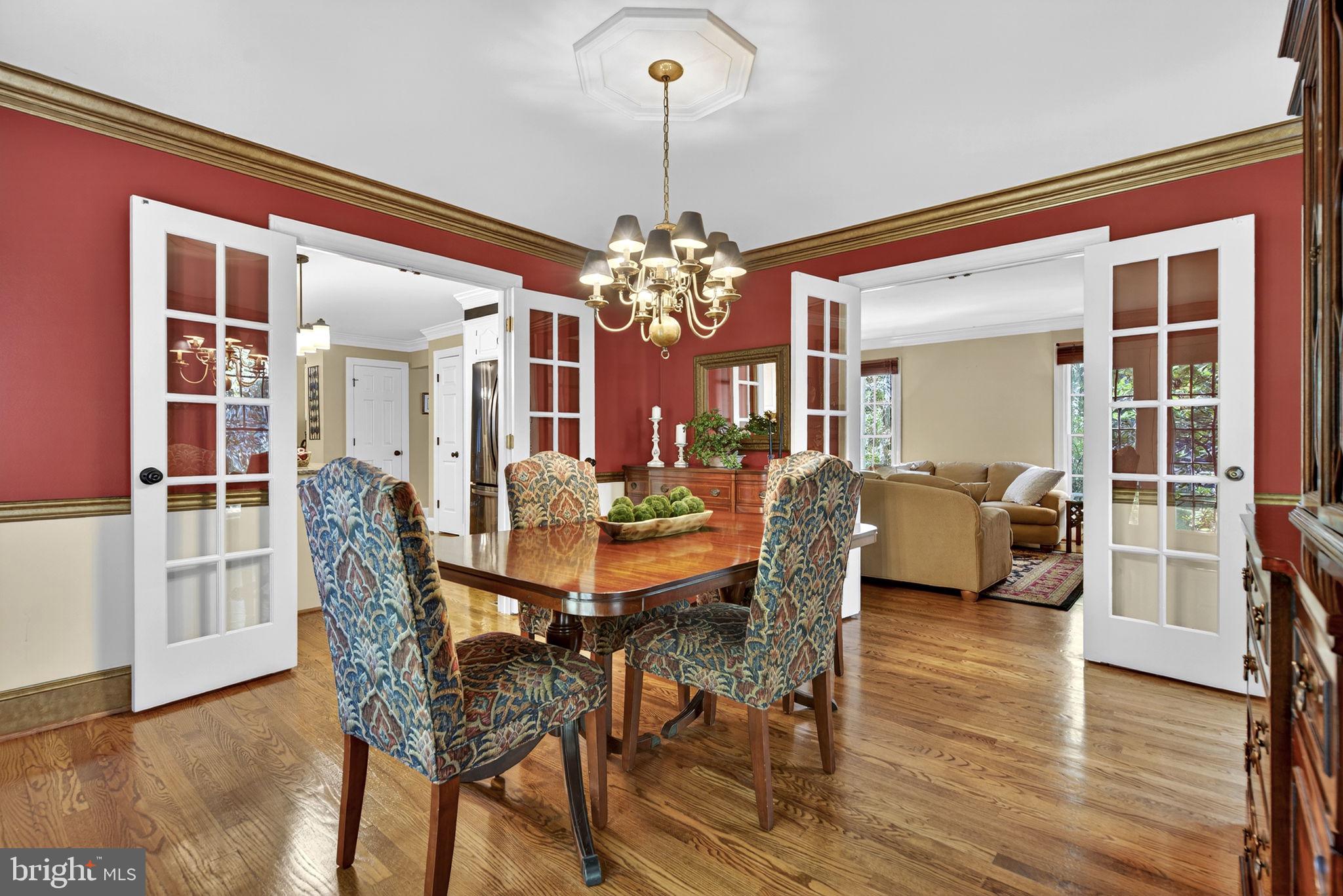 7255 Auburn Mill Road Warrenton, VA 20187 - Photo 18 of 58 a view of a dining room with furniture and wooden floor