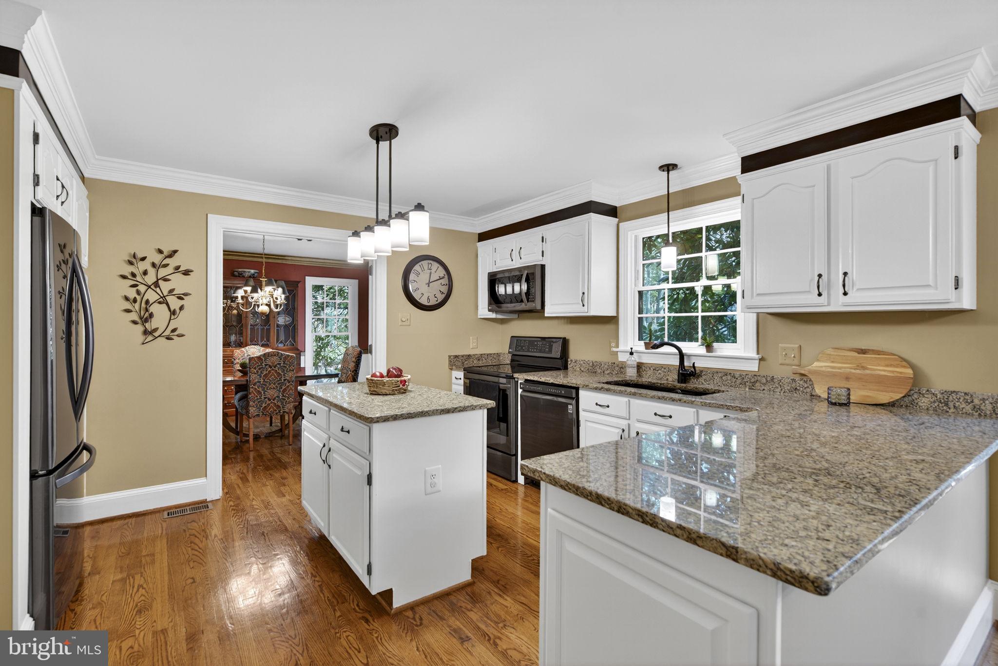 7255 Auburn Mill Road Warrenton, VA 20187 - Photo 23 of 58 a kitchen with granite countertop cabinets stainless steel appliances a sink and a counter top space