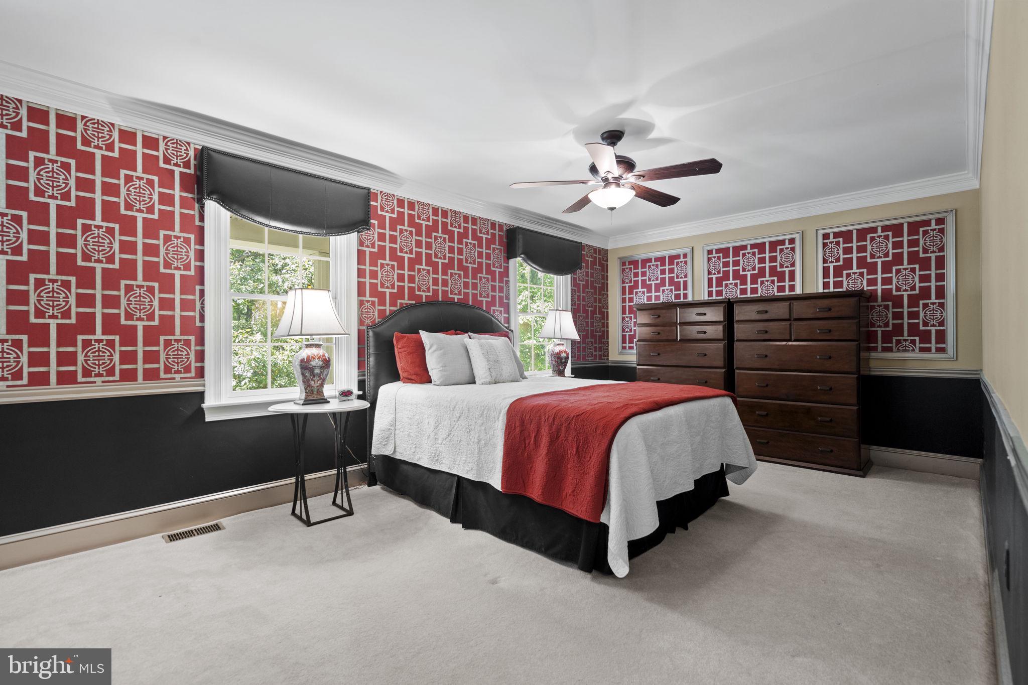 7255 Auburn Mill Road Warrenton, VA 20187 - Photo 33 of 58 a spacious bedroom with a bed and a chandelier