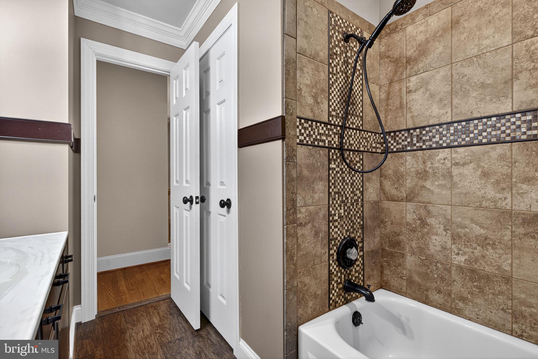 7255 Auburn Mill Road Warrenton, VA 20187 - Photo 45 of 58 a bathroom with a bathtub and shower