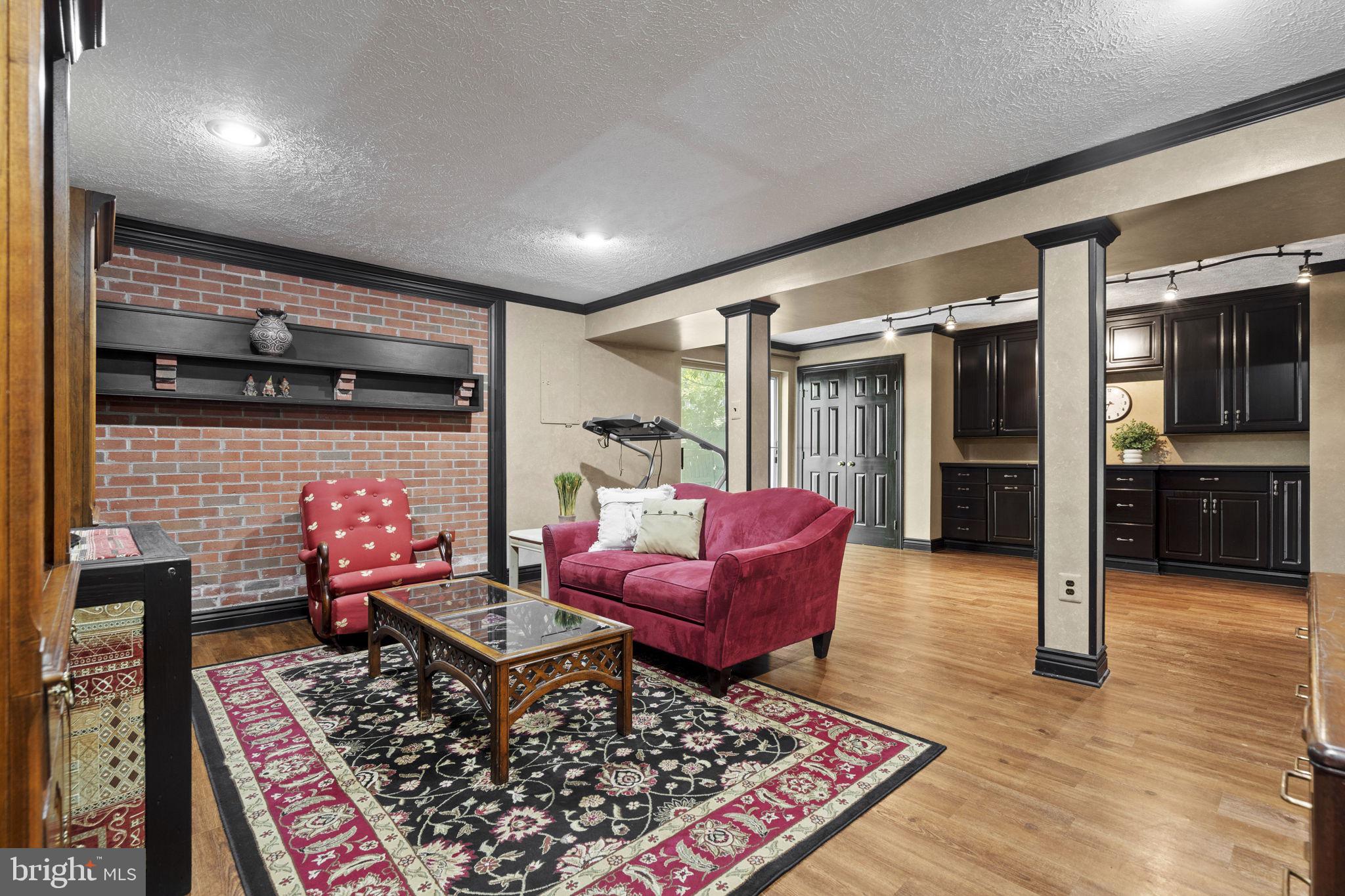 7255 Auburn Mill Road Warrenton, VA 20187 - Photo 46 of 58 a living room with furniture and a rug