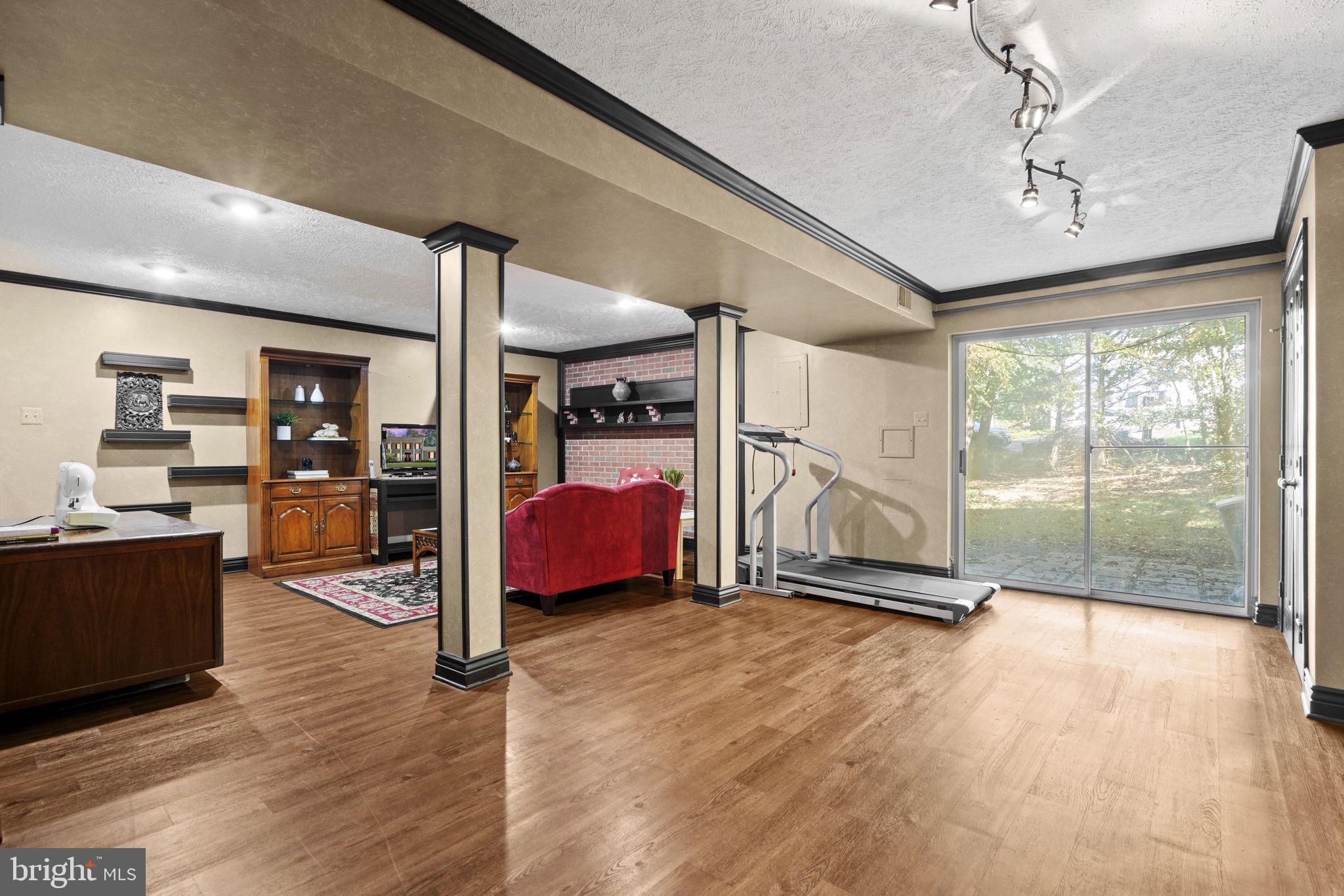 7255 Auburn Mill Road Warrenton, VA 20187 - Photo 50 of 58 a view of a room with wooden floor and furniture