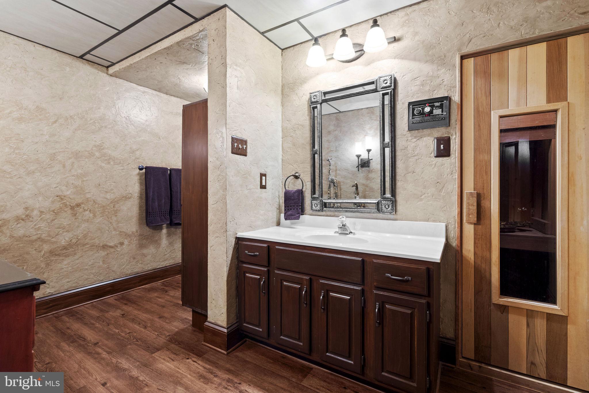 7255 Auburn Mill Road Warrenton, VA 20187 - Photo 51 of 58 a bathroom with a double vanity sink and mirror