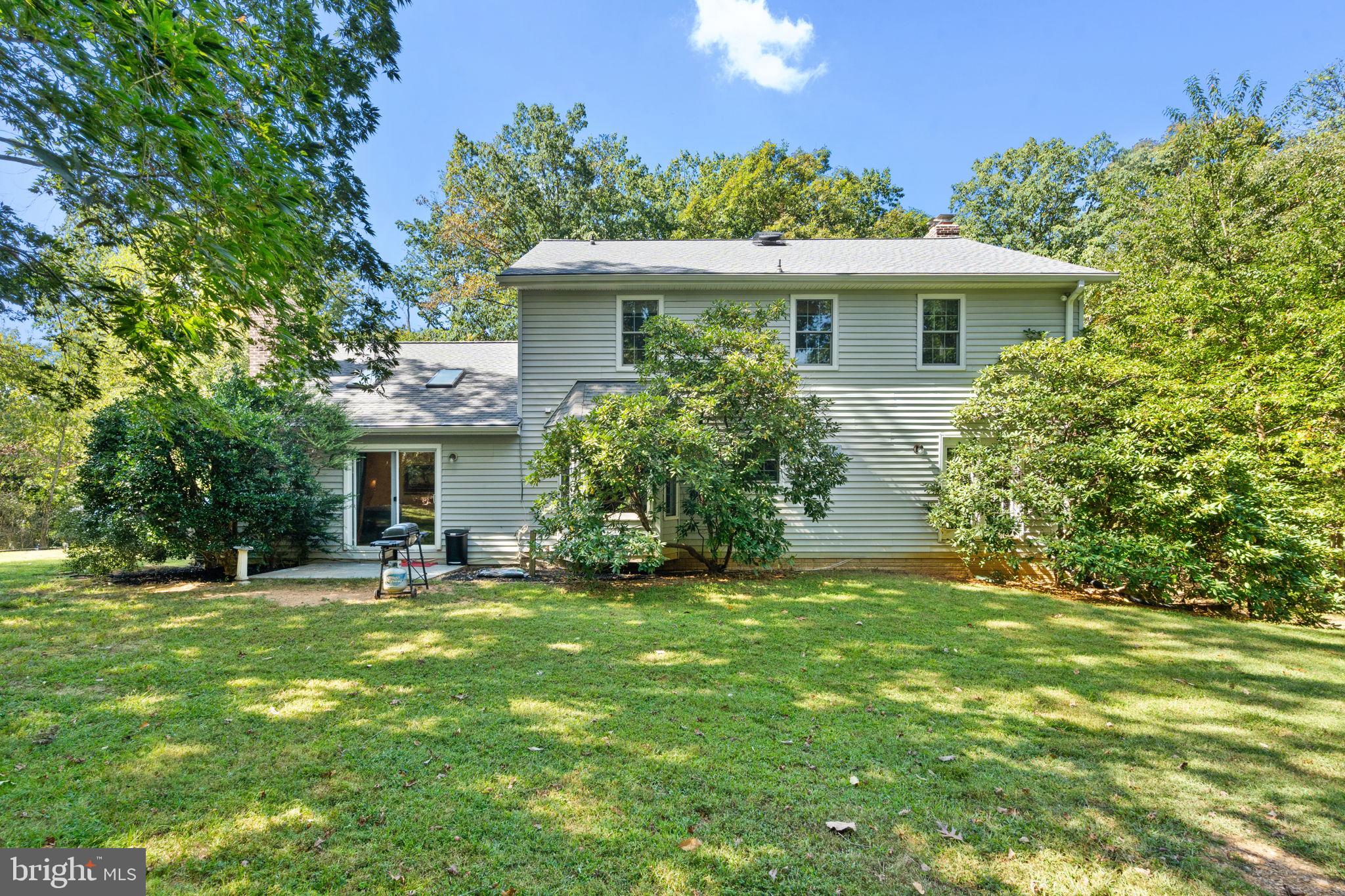 7255 Auburn Mill Road Warrenton, VA 20187 - Photo 54 of 58 a front view of a house with a garden