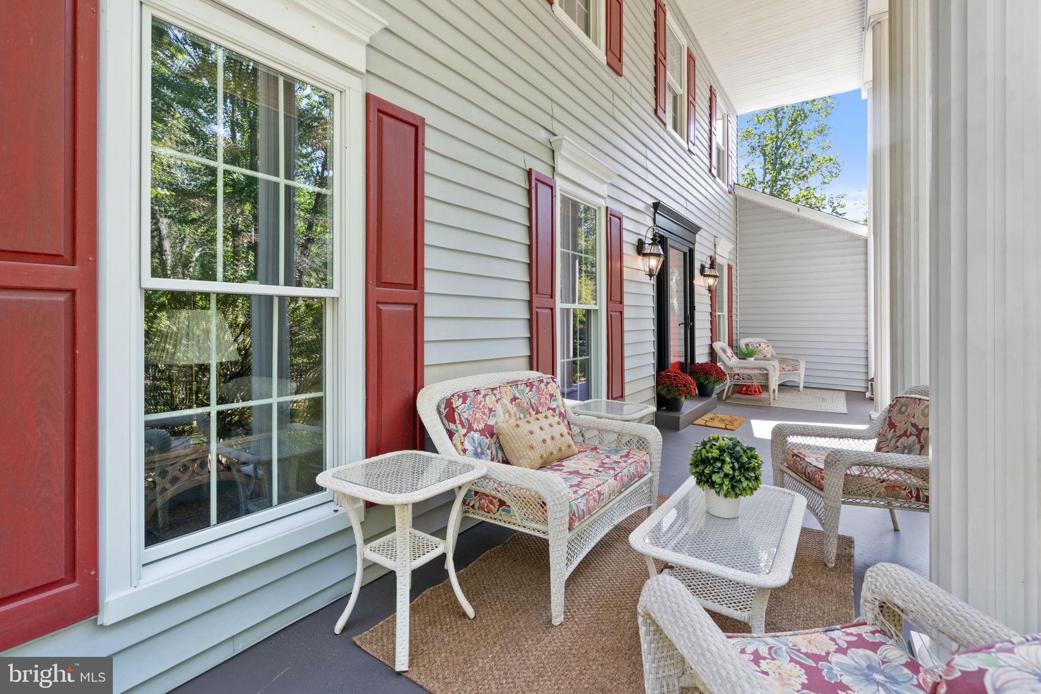 7255 Auburn Mill Road Warrenton, VA 20187 - Photo 9 of 58 a view of a patio with couple of chairs and a potted plant