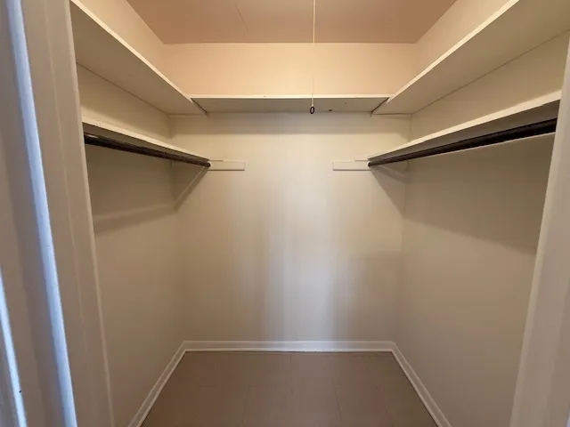 a view of an empty walk in closet