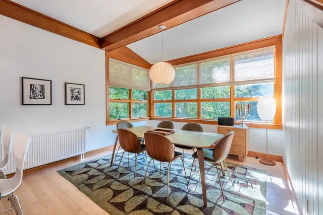 a bedroom with a bed and a book shelf