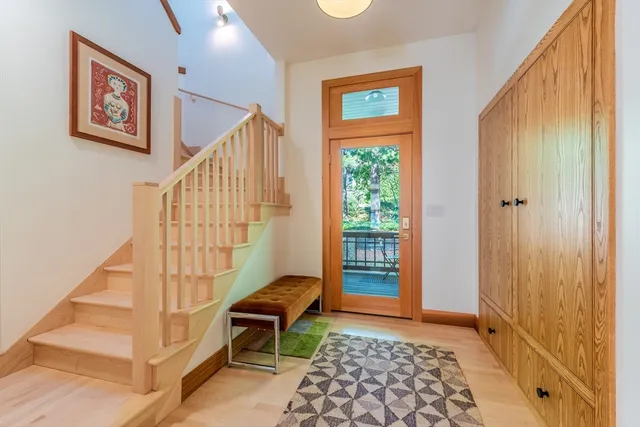 a view of a dining room with furniture a chandelier and wooden floor