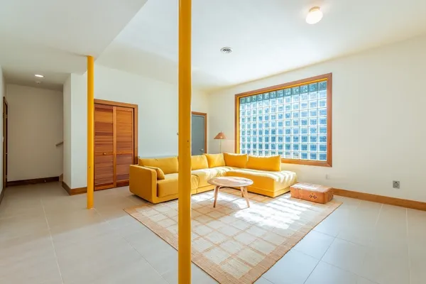 a bedroom with a bed and ceiling fan