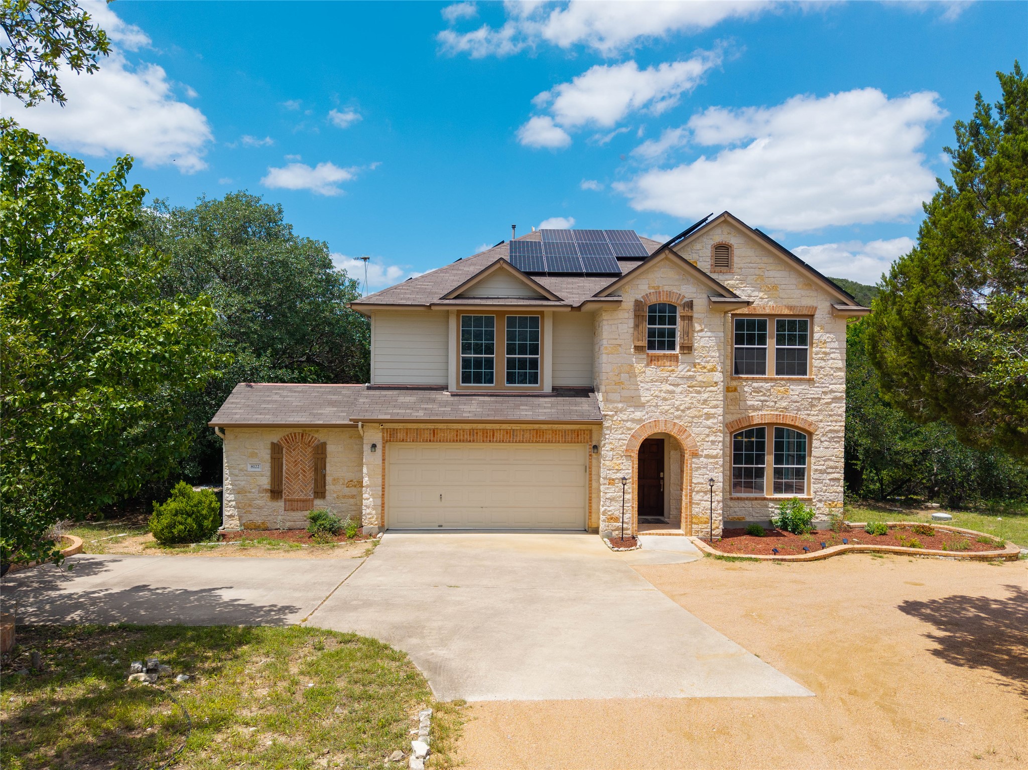 8122 Lime Creek Road Volente, TX 78641 - Photo 4 of 40 Stone 5/3 home from the front
