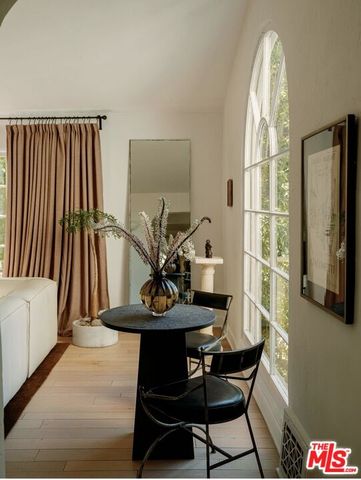 a room with a table and chairs