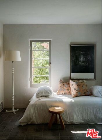 a view of balcony with furniture