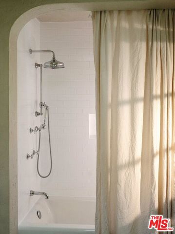 a view of room with furniture and wooden floor