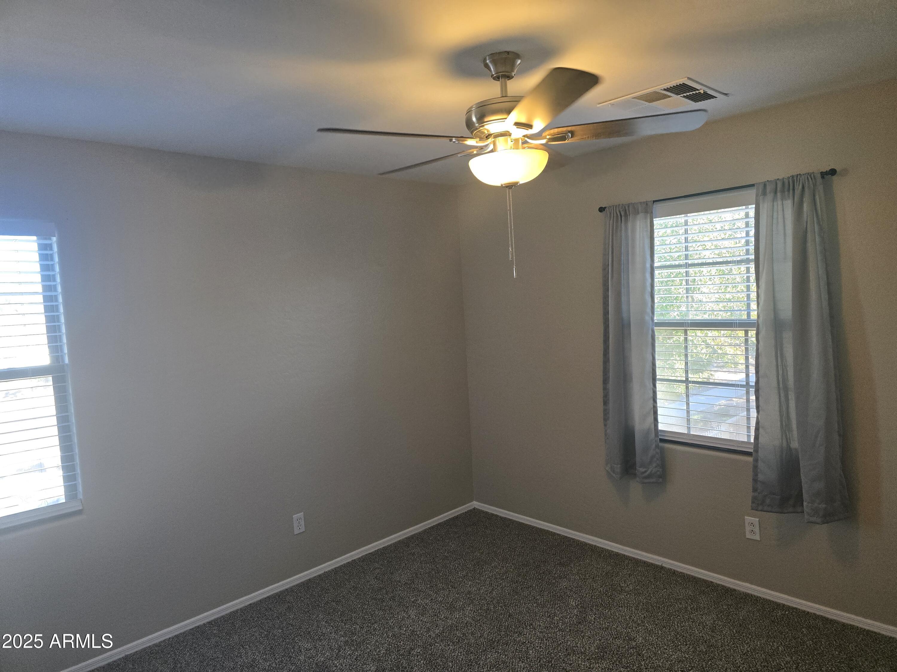 2644 East Megan Street Gilbert, AZ 85295 - Photo 12 of 21 an empty room with a window
