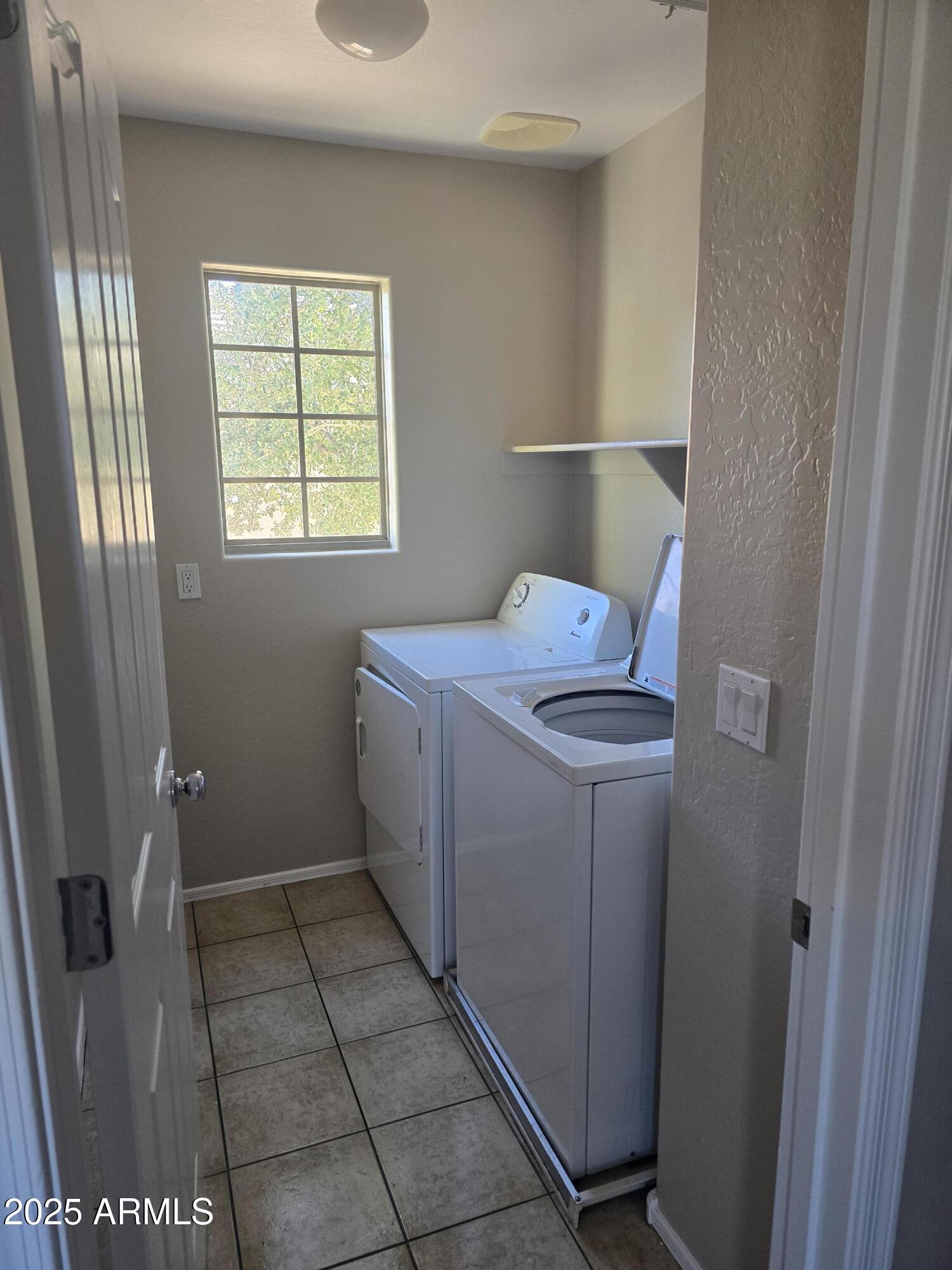 2644 East Megan Street Gilbert, AZ 85295 - Photo 16 of 21 a utility room with dryer and washer