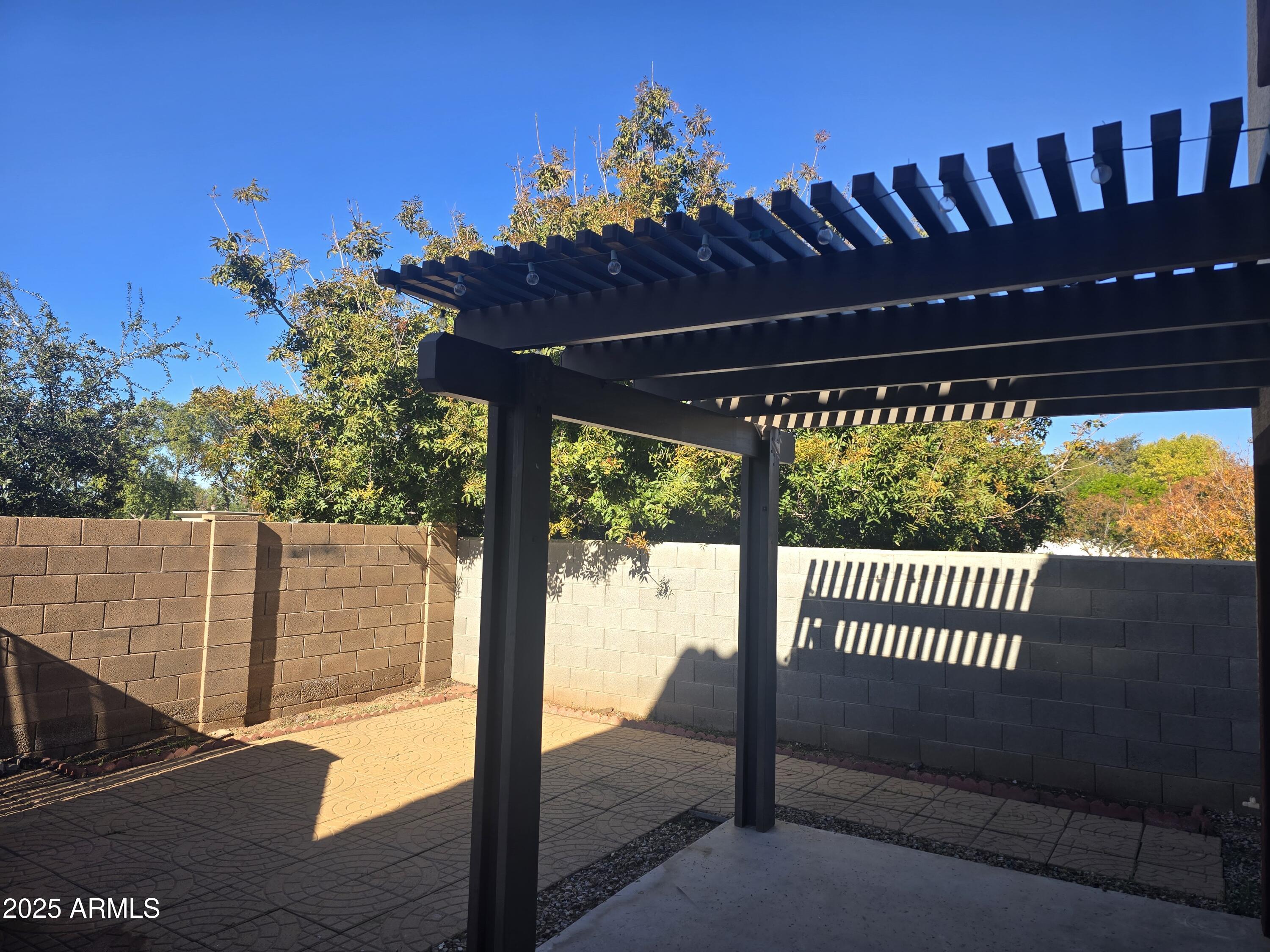 2644 East Megan Street Gilbert, AZ 85295 - Photo 18 of 21 a view of a porch with a yard