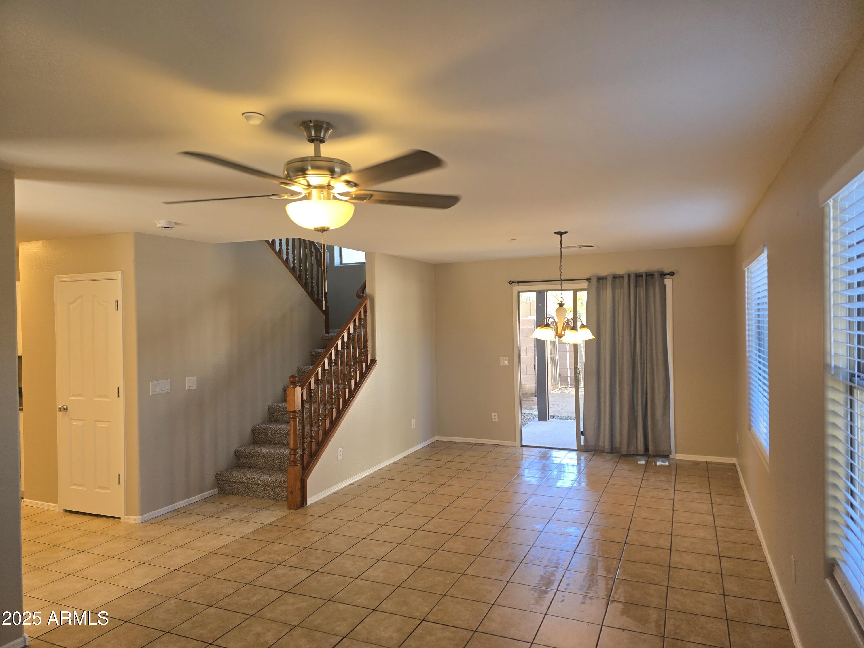 2644 East Megan Street Gilbert, AZ 85295 - Photo 6 of 21 a view of an entryway with a chandelier