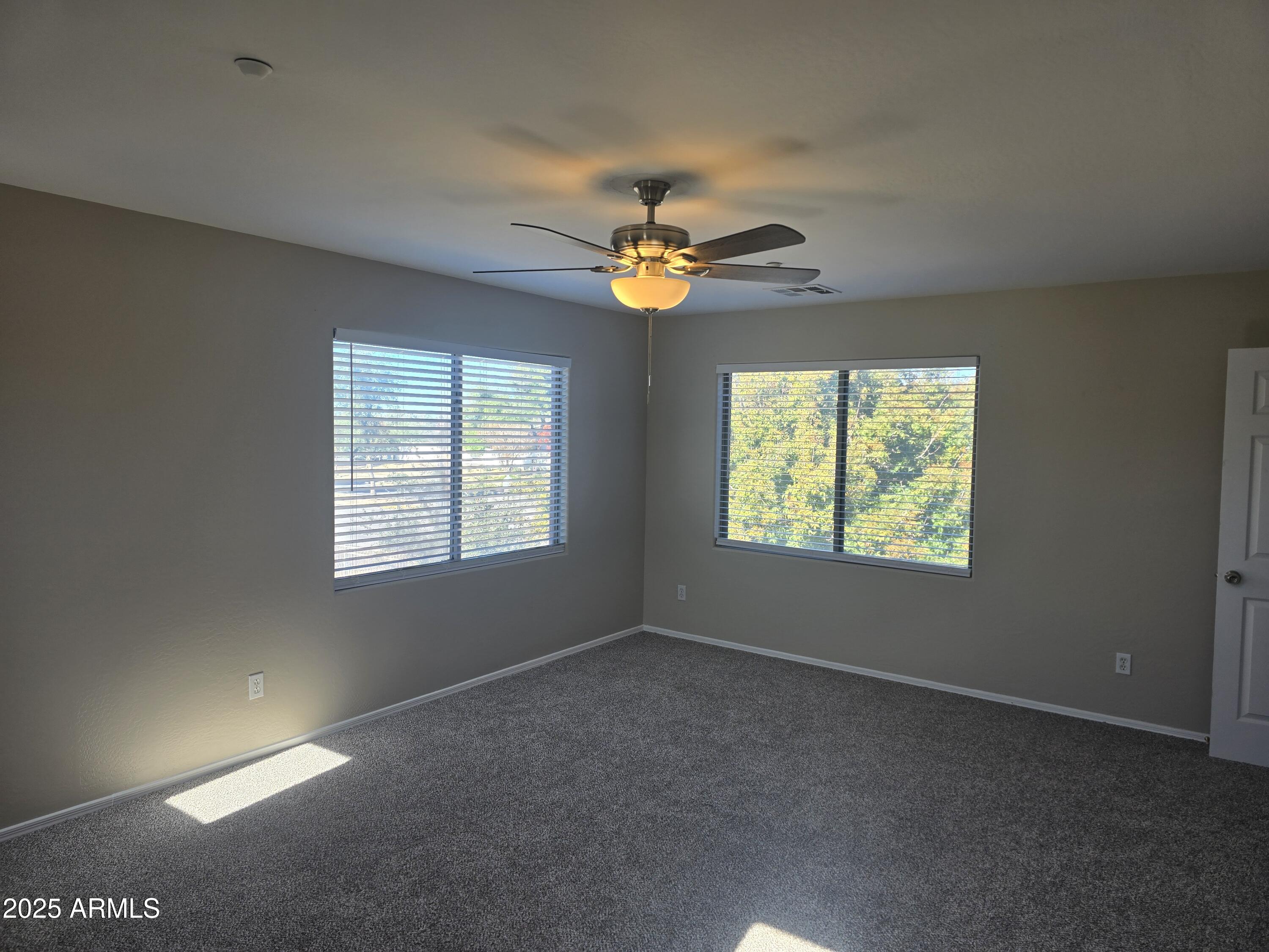 2644 East Megan Street Gilbert, AZ 85295 - Photo 8 of 21 a view of an empty room with a window