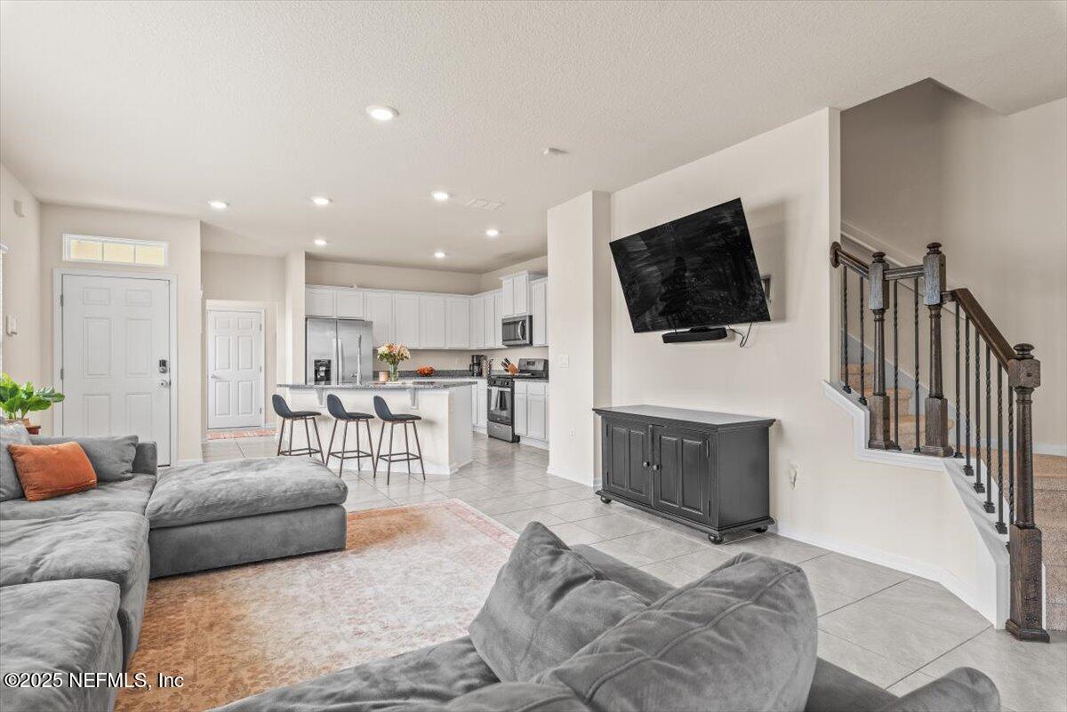 164 Java Lane St. Augustine, FL 32092 - Photo 12 of 57 a living room with furniture and a flat screen tv