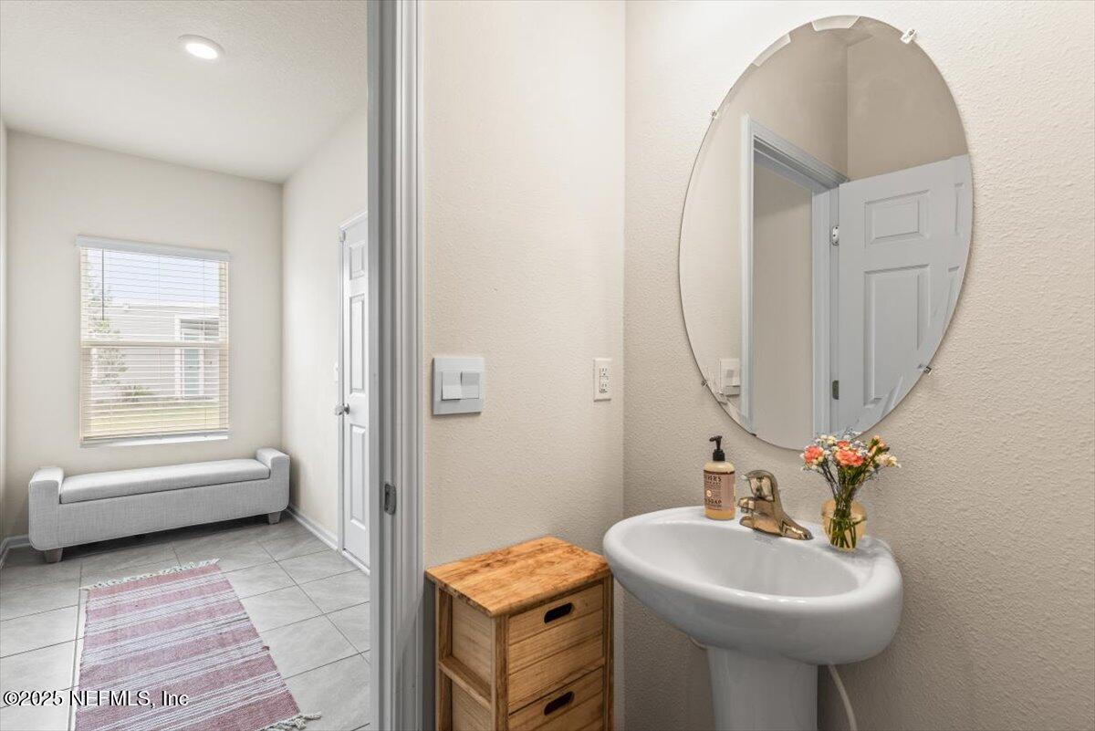 164 Java Lane St. Augustine, FL 32092 - Photo 15 of 57 a bathroom with a sink a toilet and a mirror