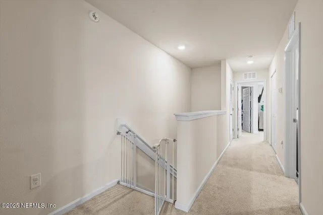 a bedroom with a bed and a lamp