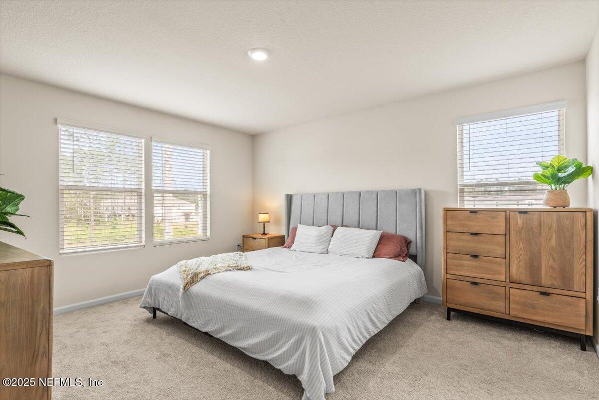 164 Java Lane St. Augustine, FL 32092 - Photo 18 of 57 a bedroom with a bed and dresser