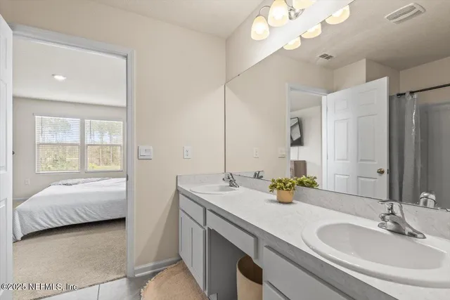 a bed room with furniture and a window