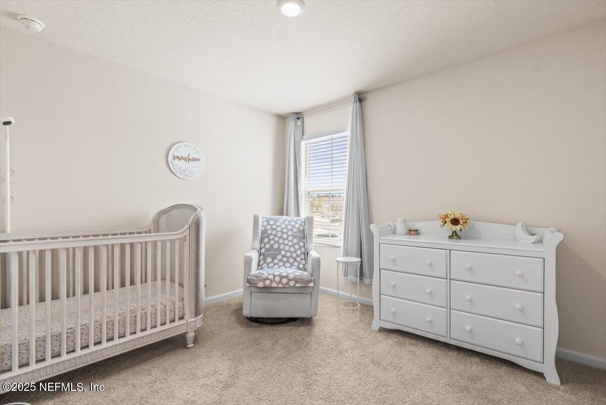 164 Java Lane St. Augustine, FL 32092 - Photo 25 of 57 a bed room with furniture and a window