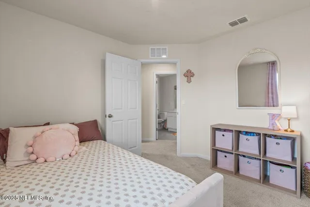 a bathroom with a sink vanity and a mirror