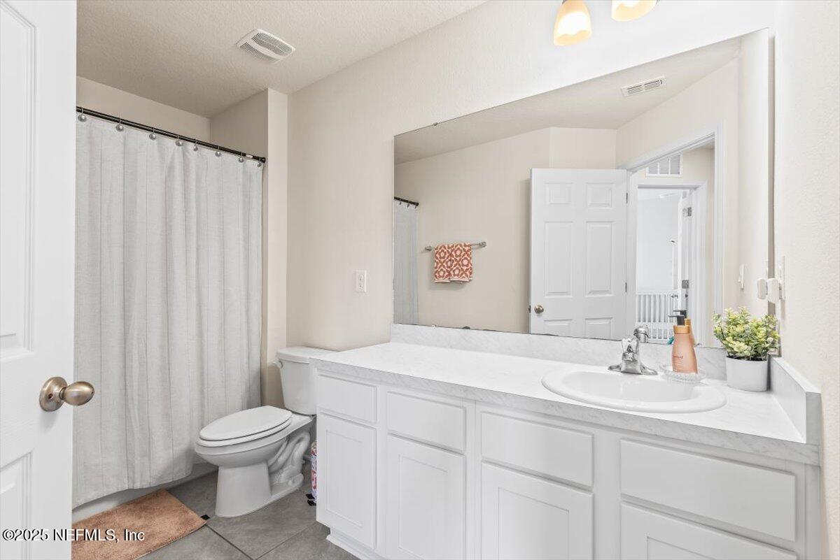 164 Java Lane St. Augustine, FL 32092 - Photo 28 of 57 a bathroom with a sink toilet and shower