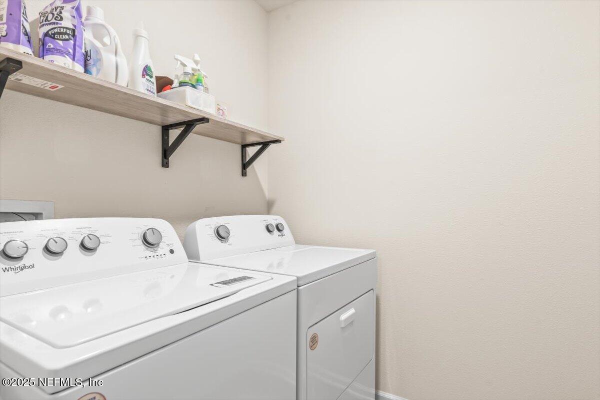 164 Java Lane St. Augustine, FL 32092 - Photo 30 of 57 a utility room with dryer and washer