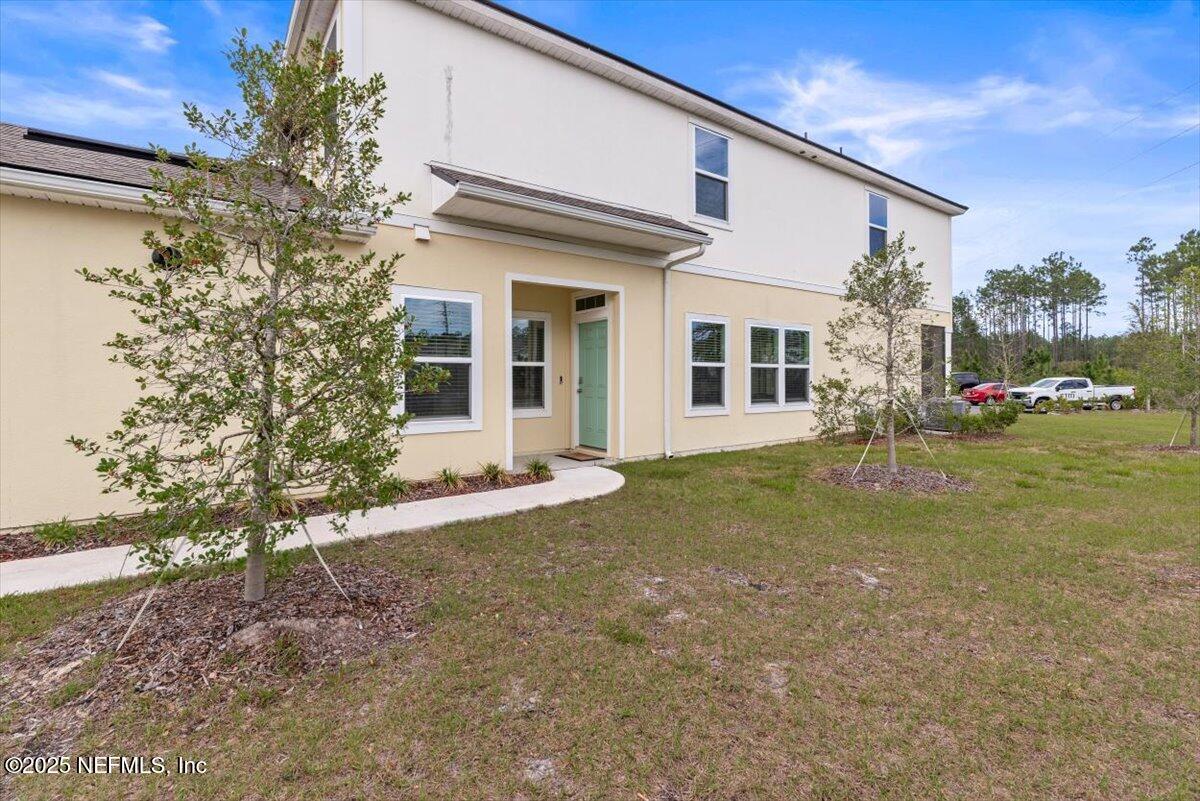 164 Java Lane St. Augustine, FL 32092 - Photo 3 of 57 a view of a house with a yard