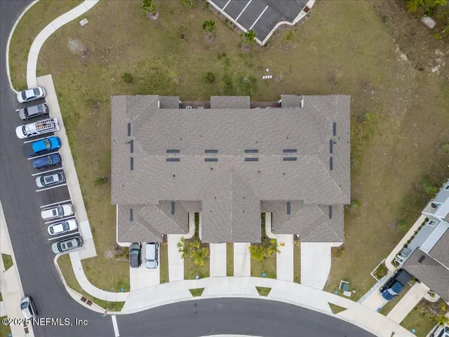an aerial view of a house with a lake view