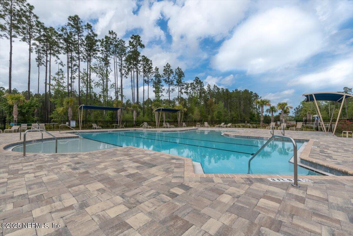 164 Java Lane St. Augustine, FL 32092 - Photo 53 of 57 a view of backyard with swimming pool and seating