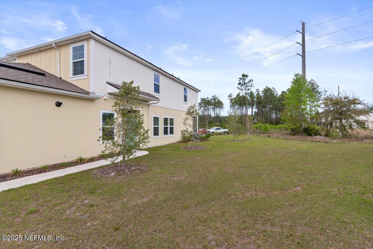 164 Java Lane St. Augustine, FL 32092 - Photo 56 of 57 a view of a house with a backyard