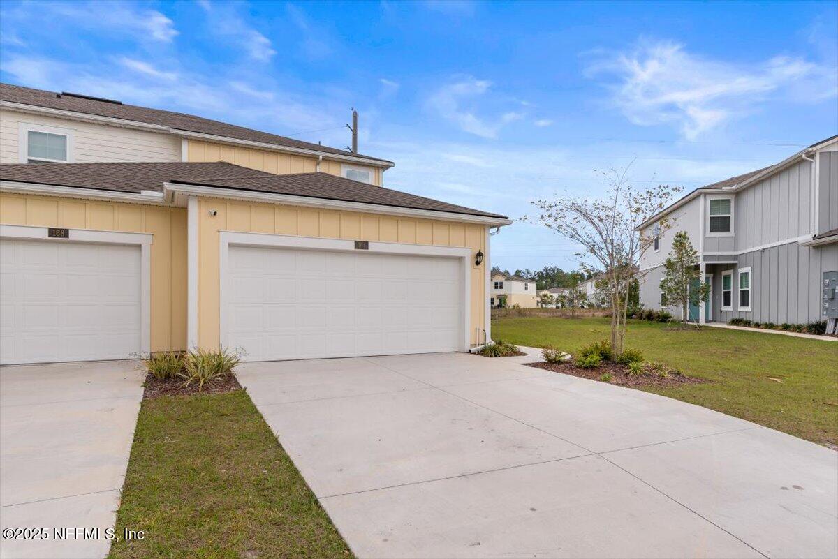 164 Java Lane St. Augustine, FL 32092 - Photo 57 of 57 front view of a house with a yard
