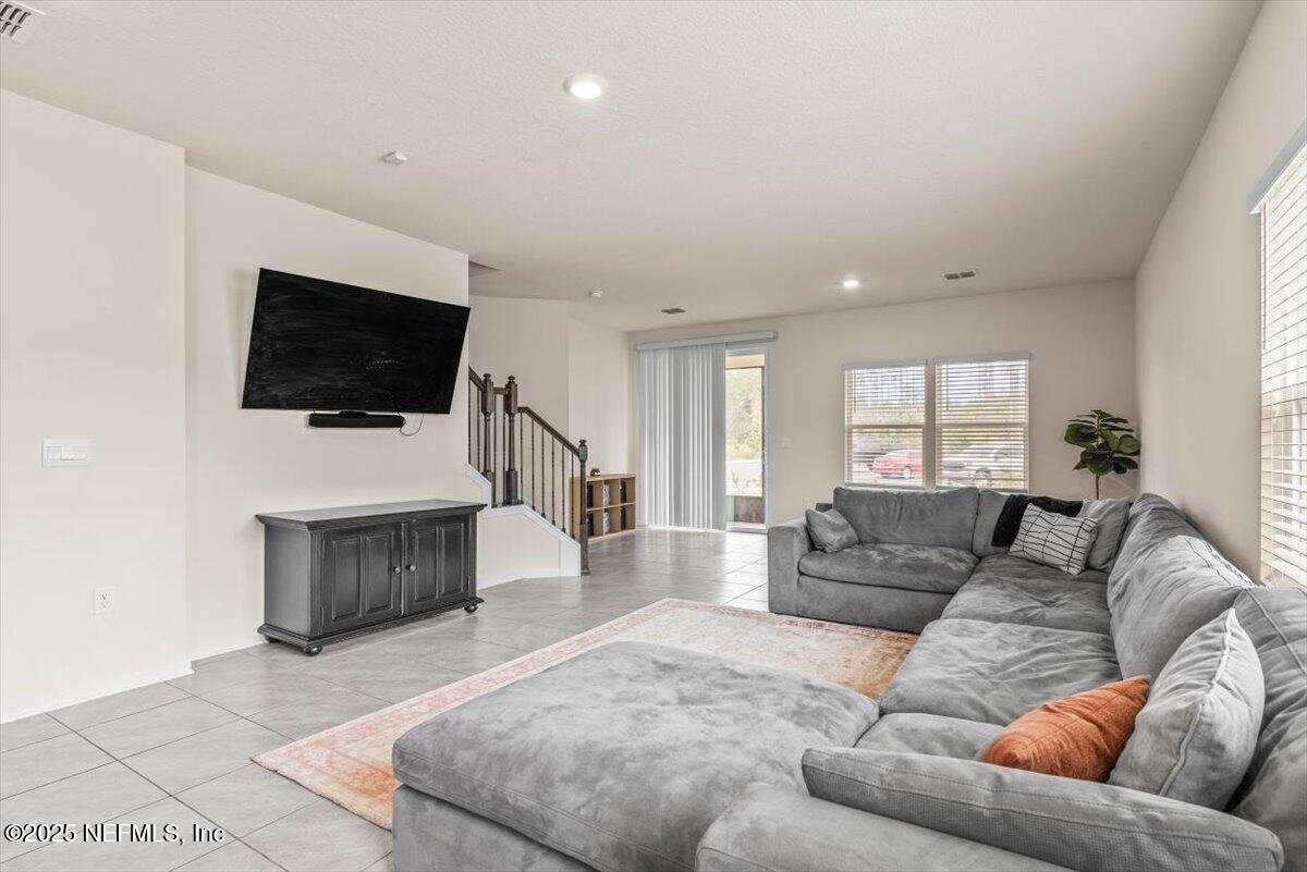 164 Java Lane St. Augustine, FL 32092 - Photo 8 of 57 a living room with furniture and a flat screen tv