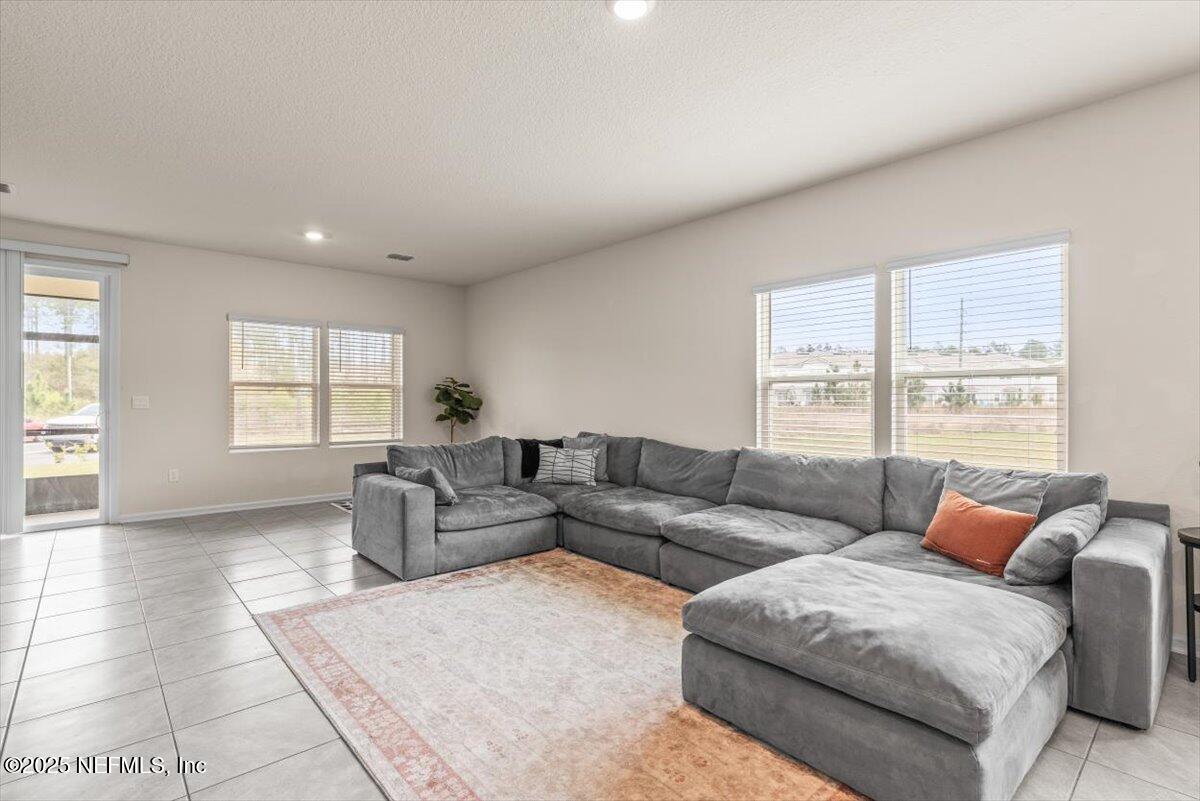 164 Java Lane St. Augustine, FL 32092 - Photo 9 of 57 a living room with furniture and a window
