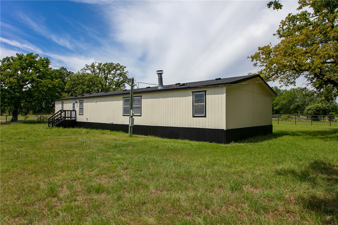 11459 Winstead Lane Calvert, TX 77837 - Photo 26 of 37 a house view with a garden space