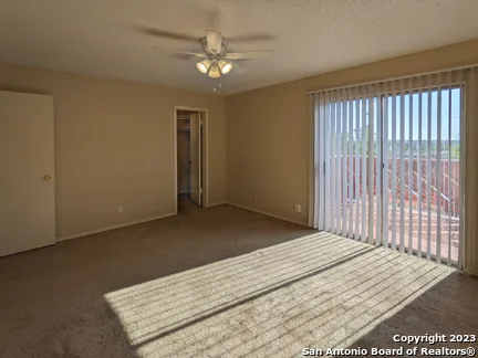 a view of a bedroom with wooden floor