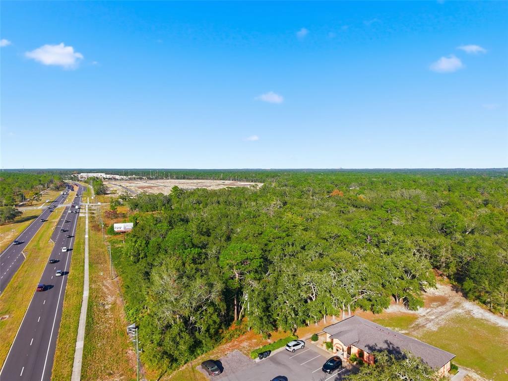 11254 Commercial Way Weeki Wachee, FL 34614 - Photo 12 of 15 a view of an outdoor space and a yard
