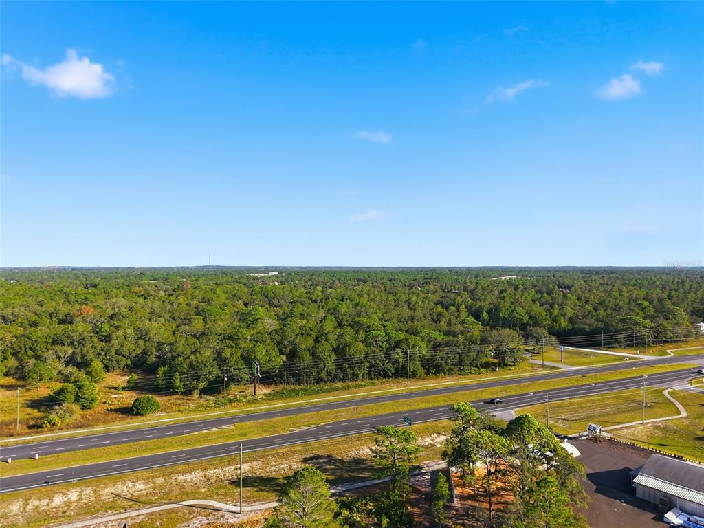 11254 Commercial Way Weeki Wachee, FL 34614 - Photo 9 of 15 a view of an ocean and a mountain view