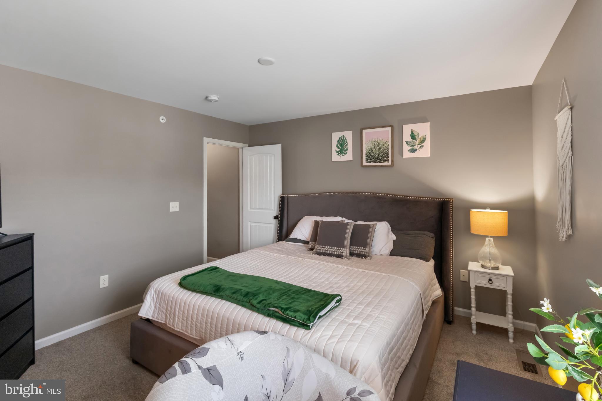 508 Byler Circle Lebanon, PA 17042 - Photo 22 of 33 a bedroom with a bed and a lamp