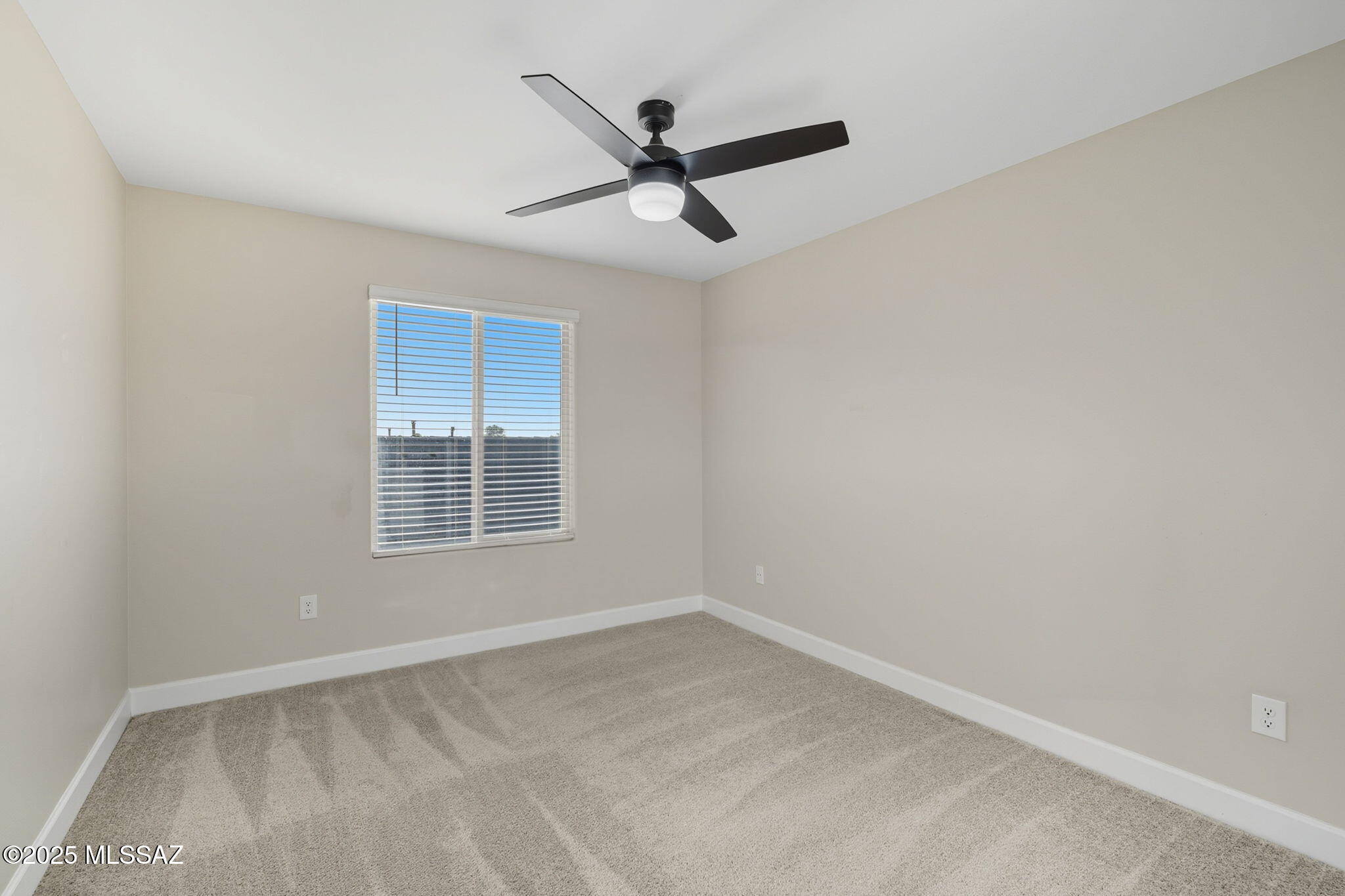 12100 East Ryscott Circle Vail, AZ 85641 - Photo 34 of 53 a view of a livingroom with a ceiling fan and window