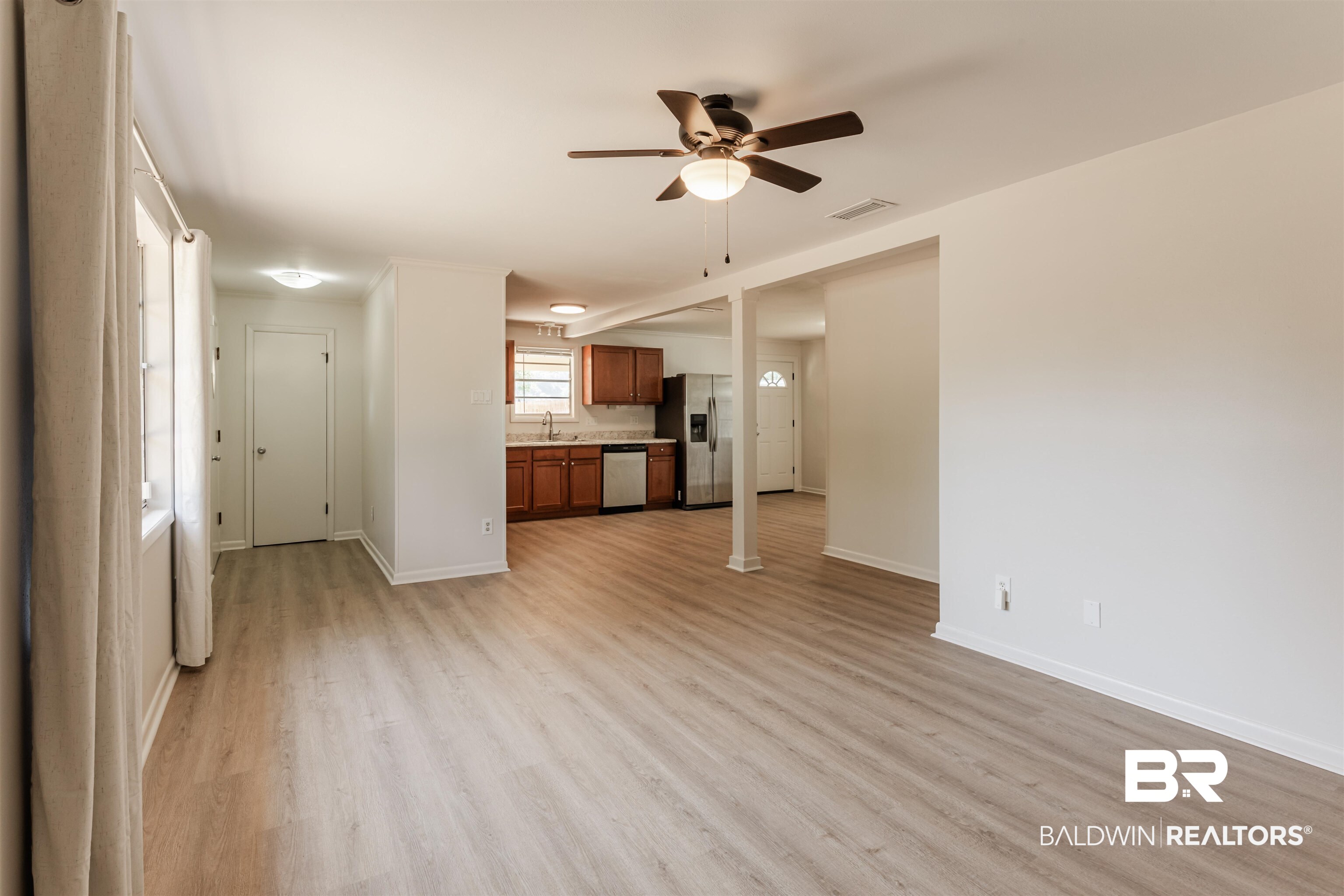 3970 Oak Ridge Avenue Mobile, AL 36619 - Photo 4 of 28 Unfurnished living room with light hardwood / wood-style floors, sink, and ceiling fan