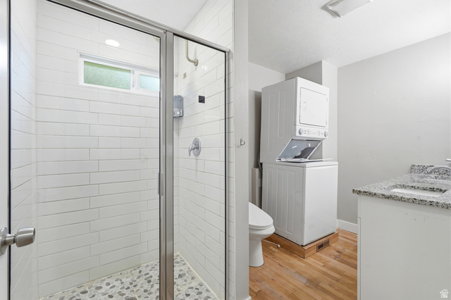 778 East 200 North Logan, UT 84321 - Photo 27 of 43 Shower with glass enclosure and pebble-tile flooring, complemented by white subway tile walls